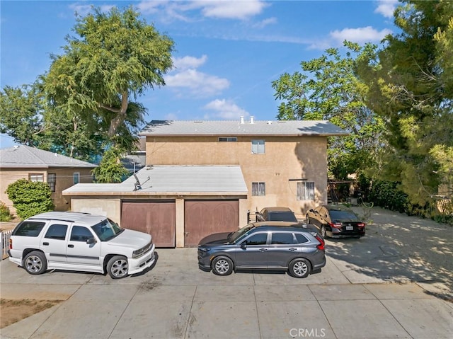 146 W Glendon Way, San Gabriel, CA 91776 - view of front of house featuring driveway, stucco siding, and a garage