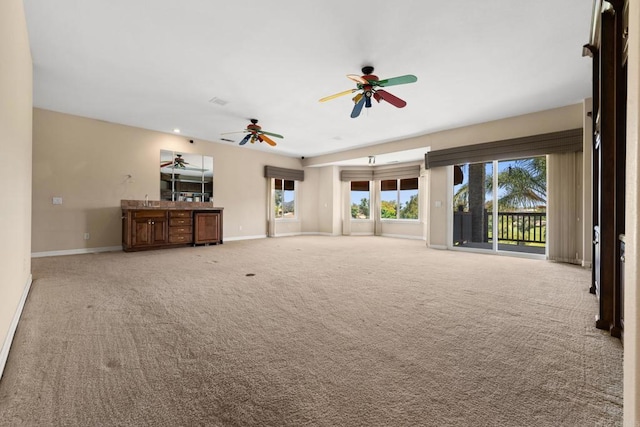 30700 Spyglass Way, Canyon Lake, CA 92587 - unfurnished living room with a ceiling fan, light carpet, baseboards, and plenty of natural light