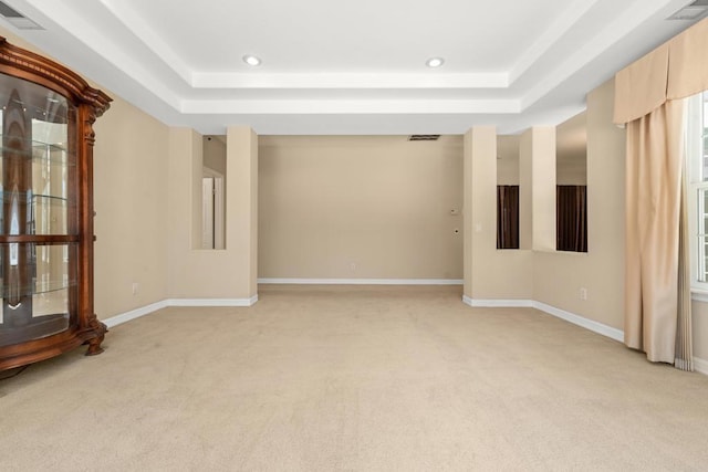 30700 Spyglass Way, Canyon Lake, CA 92587 - spare room featuring a tray ceiling, light carpet, recessed lighting, and baseboards