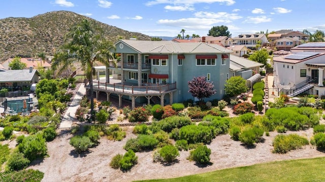 30700 Spyglass Way, Canyon Lake, CA 92587 - rear view of property with a balcony, a mountain view, a residential view, and stucco siding
