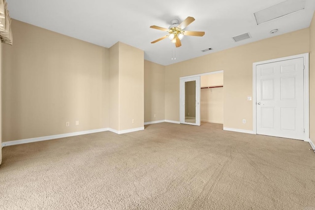 30700 Spyglass Way, Canyon Lake, CA 92587 - unfurnished bedroom with carpet, baseboards, a ceiling fan, a walk in closet, and attic access