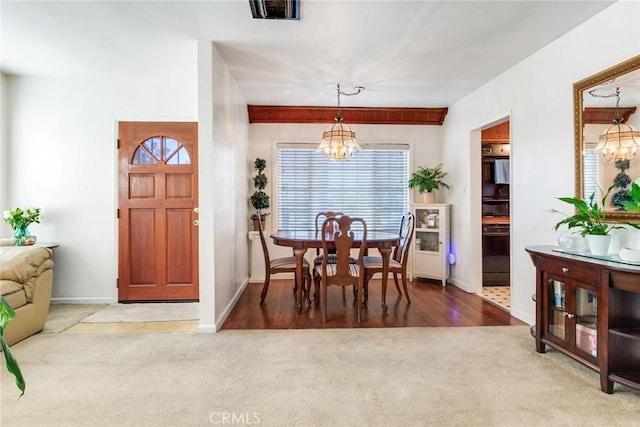 946 W 9th St, Corona, CA 92882 - carpeted dining space featuring a chandelier and baseboards