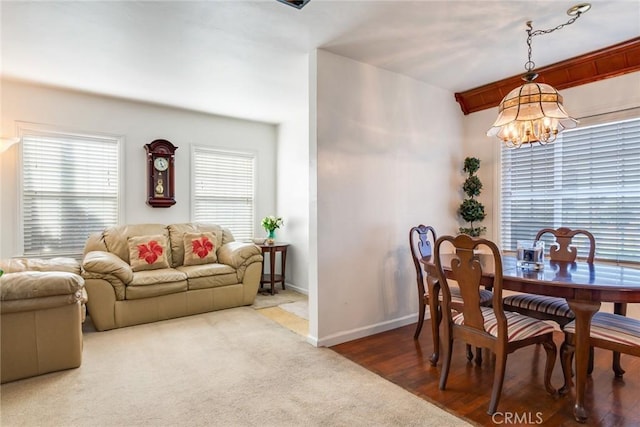 946 W 9th St, Corona, CA 92882 - carpeted dining space with a chandelier and baseboards
