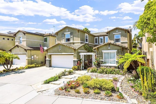 7132 Torrey Mesa Ct, San Diego, CA 92129 - view of front of home with stucco siding, driveway, an attached garage, and stone siding
