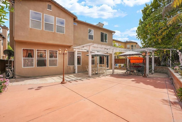 7132 Torrey Mesa Ct, San Diego, CA 92129 - back of property with a pergola, stucco siding, a patio area, a chimney, and outdoor dining area