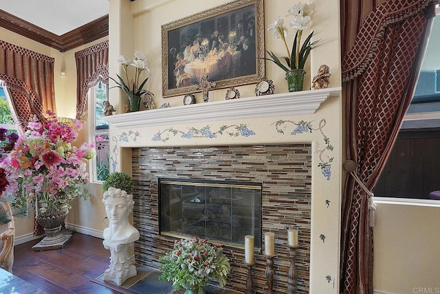 7132 Torrey Mesa Ct, San Diego, CA 92129 - detailed view of wood finished floors, baseboards, a tiled fireplace, and crown molding
