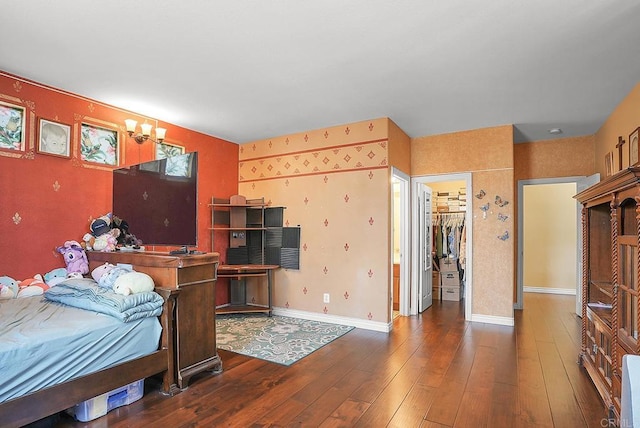7132 Torrey Mesa Ct, San Diego, CA 92129 - bedroom with wood-type flooring, a spacious closet, baseboards, and a closet