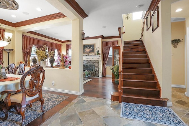 7132 Torrey Mesa Ct, San Diego, CA 92129 - entryway featuring stairway, crown molding, stone finish floors, a fireplace, and baseboards