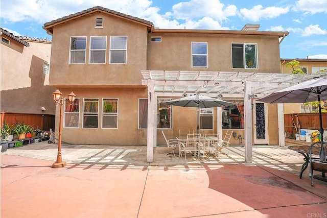 7132 Torrey Mesa Ct, San Diego, CA 92129 - back of property with a pergola, stucco siding, a patio area, and outdoor dining area