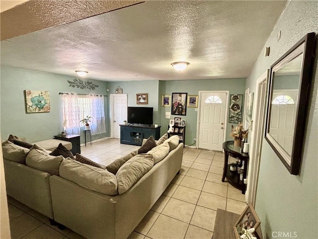 16739 Upland, Fontana, CA 92335 - living area featuring light tile patterned floors and a textured ceiling