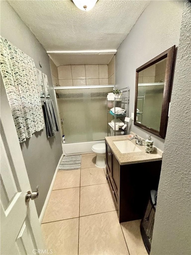 16739 Upland, Fontana, CA 92335 - full bath with a textured ceiling, tile patterned floors, vanity, toilet, and enclosed tub / shower combo