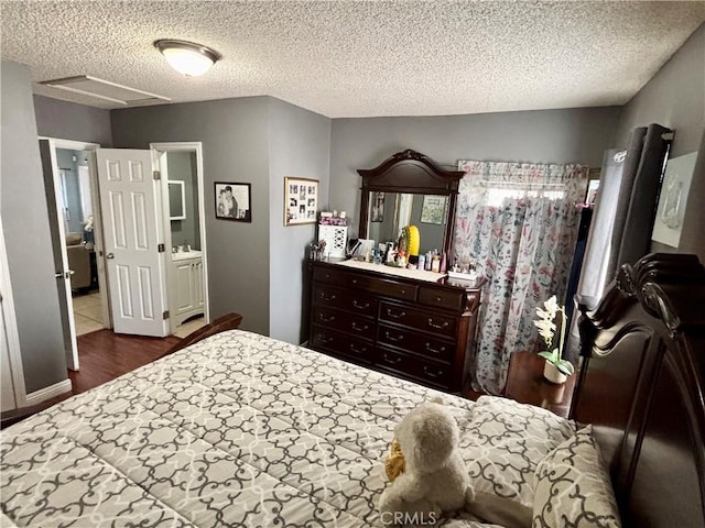 16739 Upland, Fontana, CA 92335 - bedroom featuring a textured ceiling and wood finished floors
