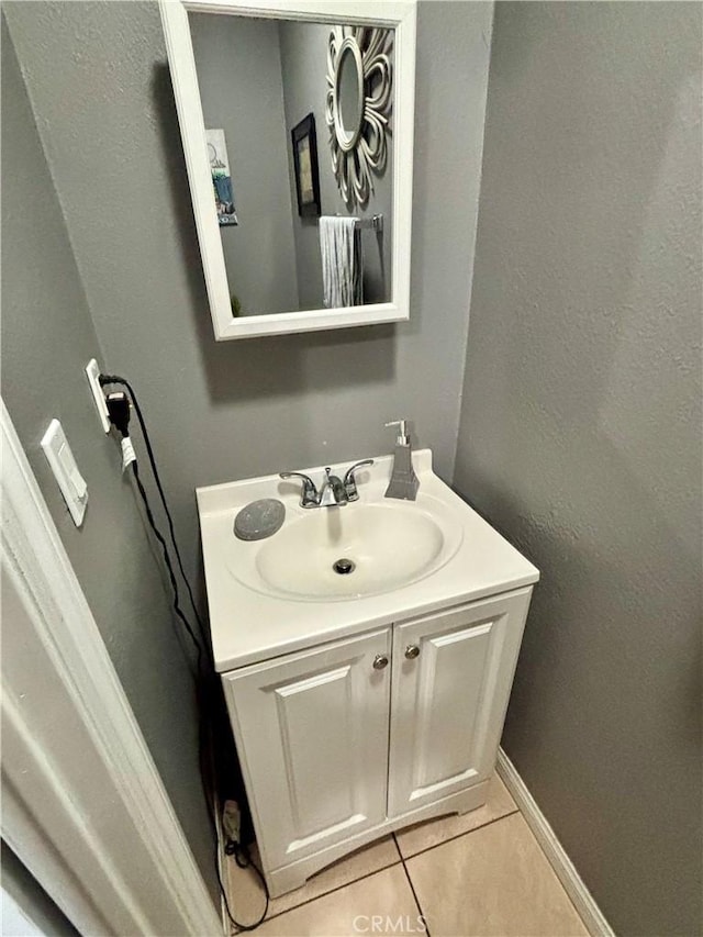 16739 Upland, Fontana, CA 92335 - bathroom with tile patterned floors, vanity, and baseboards