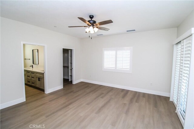 14812 Crofton Ln, Helendale, CA 92342 - unfurnished bedroom with wood finished floors, baseboards, and a closet