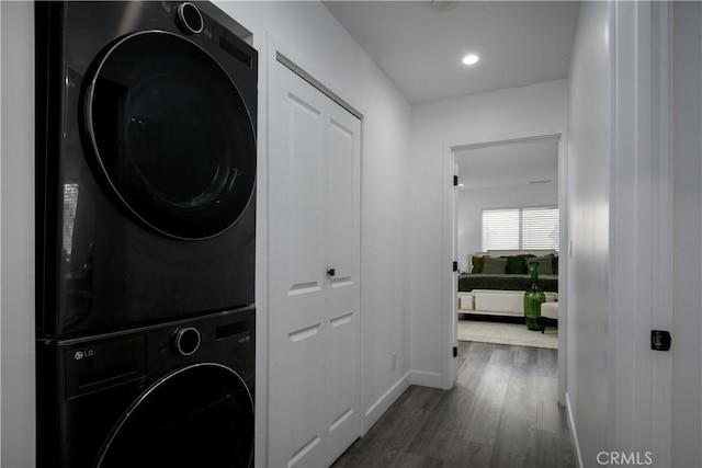 10806 S St Andrews Pl, Los Angeles, CA 90047 - washroom featuring stacked washer / dryer, baseboards, wood finished floors, and recessed lighting
