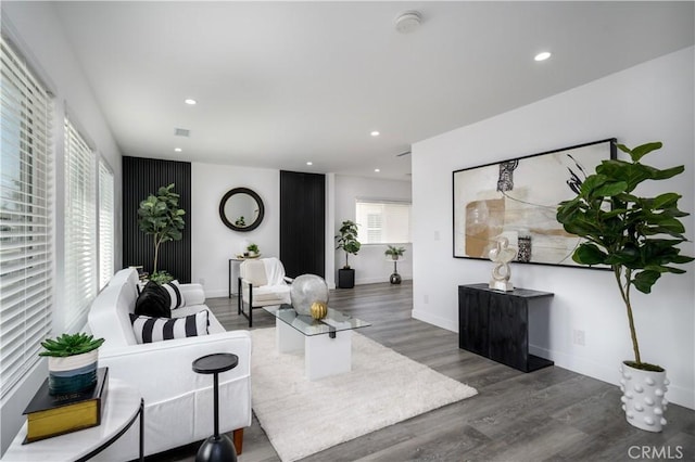 10806 S St Andrews Pl, Los Angeles, CA 90047 - living area with wood finished floors, recessed lighting, and baseboards