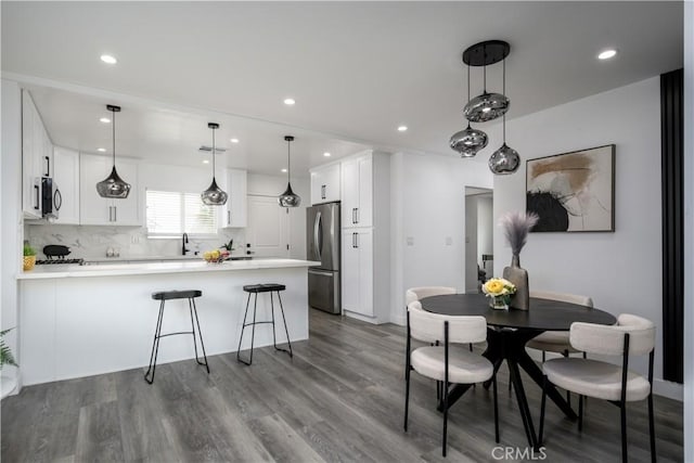 10806 S St Andrews Pl, Los Angeles, CA 90047 - dining space with dark wood-style flooring and recessed lighting