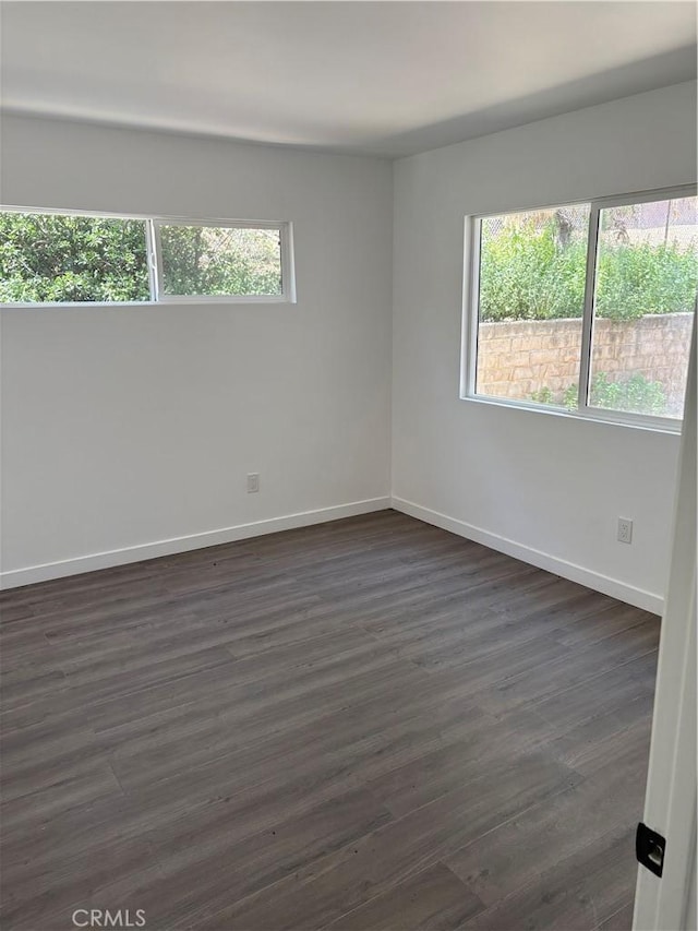 22555 Fern Ann Falls Rd, Chatsworth, CA 91311 - unfurnished room featuring baseboards and dark wood-type flooring