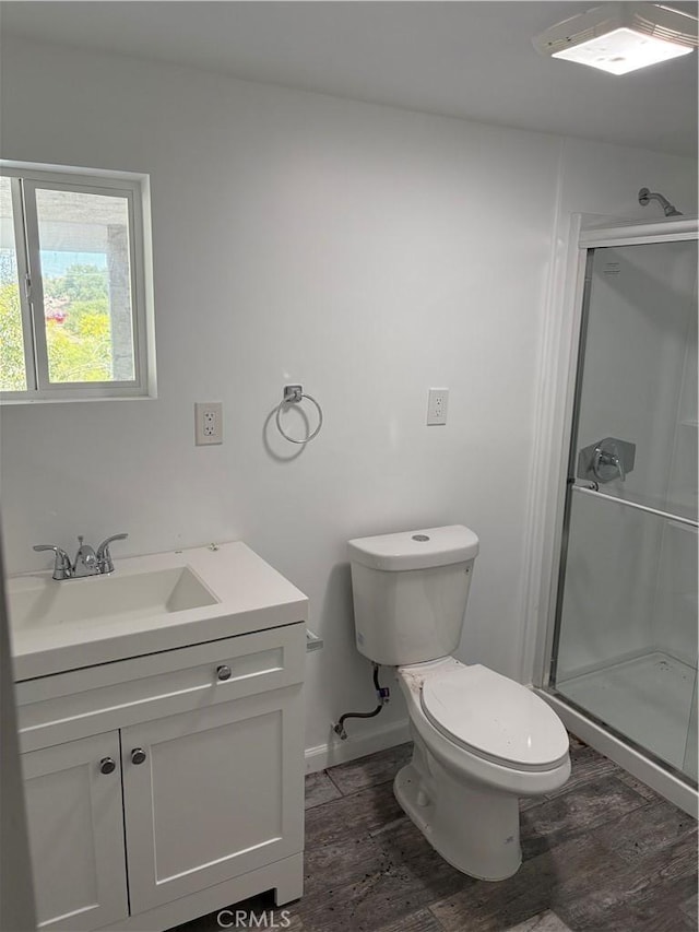 22555 Fern Ann Falls Rd, Chatsworth, CA 91311 - bathroom featuring wood finished floors, a stall shower, toilet, and vanity