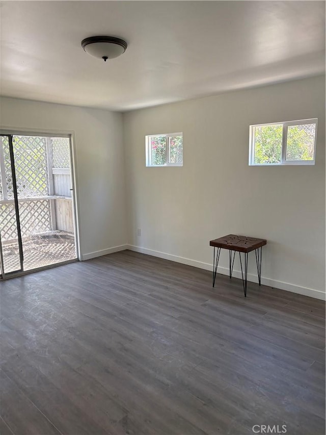 22555 Fern Ann Falls Rd, Chatsworth, CA 91311 - spare room featuring plenty of natural light, baseboards, and dark wood-style floors
