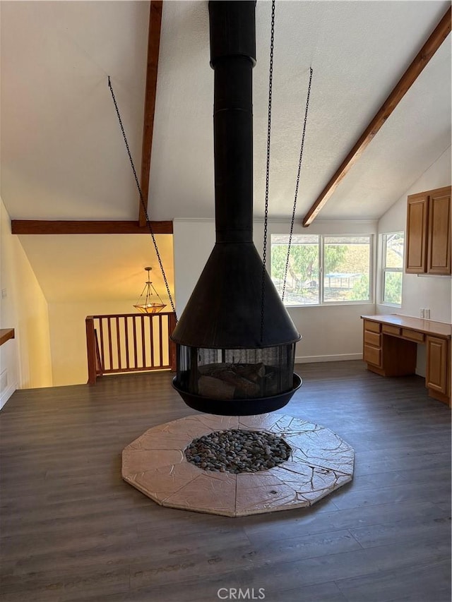 22555 Fern Ann Falls Rd, Chatsworth, CA 91311 - detailed view of a wood stove, baseboards, wood finished floors, and a fire pit