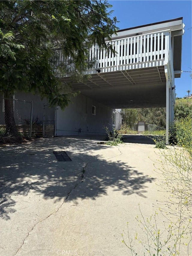 22555 Fern Ann Falls Rd, Chatsworth, CA 91311 - view of front facade featuring a carport and driveway