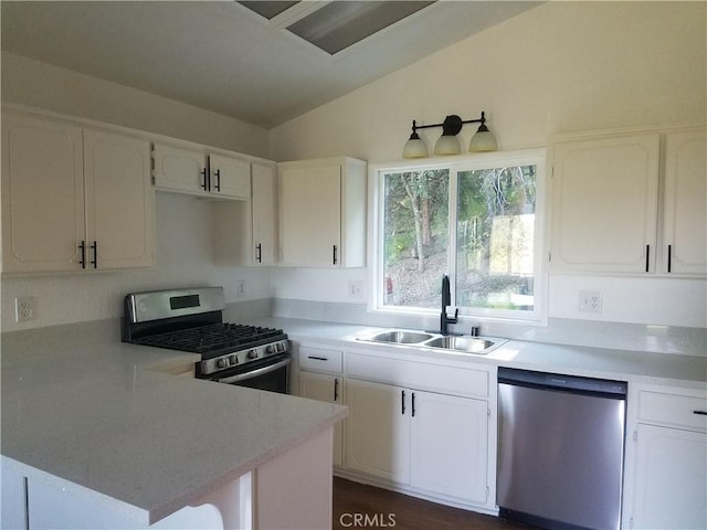 587 Spring Dr, Cedarpines Park, CA 92322 - kitchen featuring stainless steel appliances, a sink, white cabinetry, and lofted ceiling