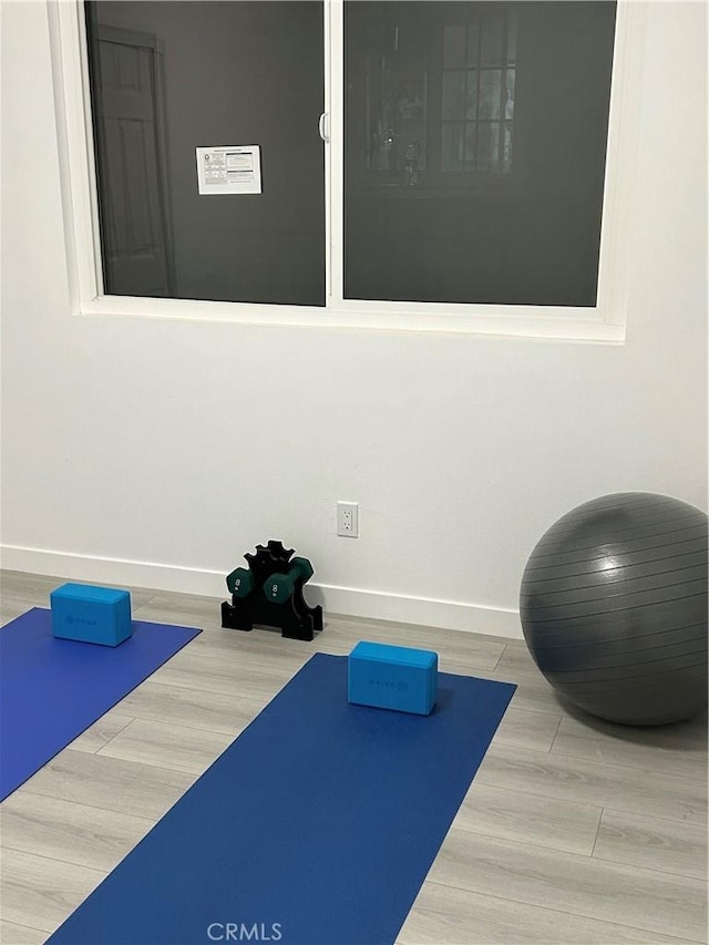 8916 Mettler Ave, Los Angeles, CA 90003 - exercise area featuring baseboards and wood finished floors