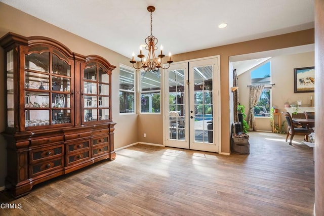 35135 Caprock Rd, Santa Clarita, CA 91390 - unfurnished dining area with french doors, a chandelier, wood finished floors, and recessed lighting