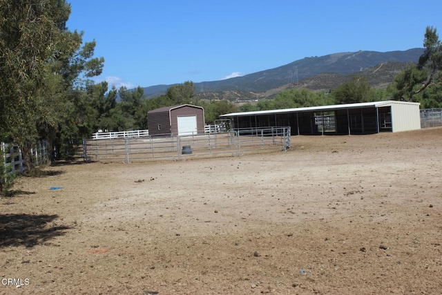 35135 Caprock Rd, Santa Clarita, CA 91390 - view of yard with an exterior structure, a mountain view, and an outdoor structure