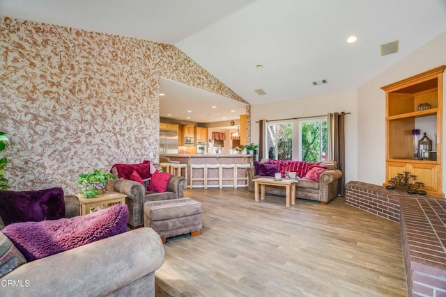 35135 Caprock Rd, Santa Clarita, CA 91390 - living area featuring lofted ceiling, light wood finished floors, and wallpapered walls