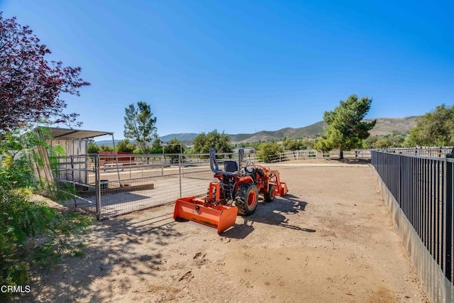 35135 Caprock Rd, Santa Clarita, CA 91390 - view of play area featuring a mountain view, an exterior structure, and an outbuilding