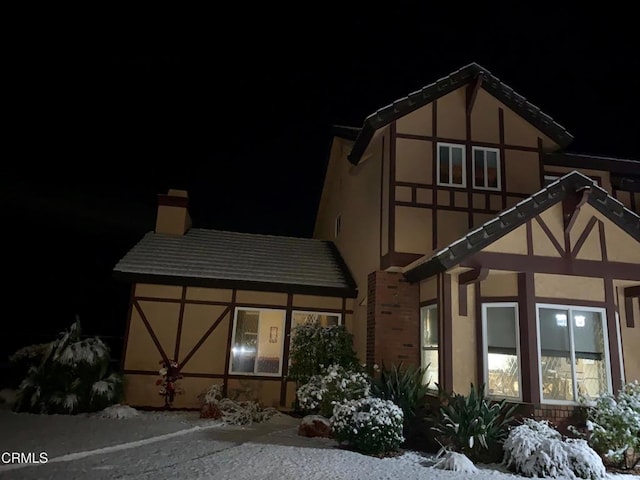 35135 Caprock Rd, Santa Clarita, CA 91390 - snow covered rear of property featuring stucco siding and a chimney