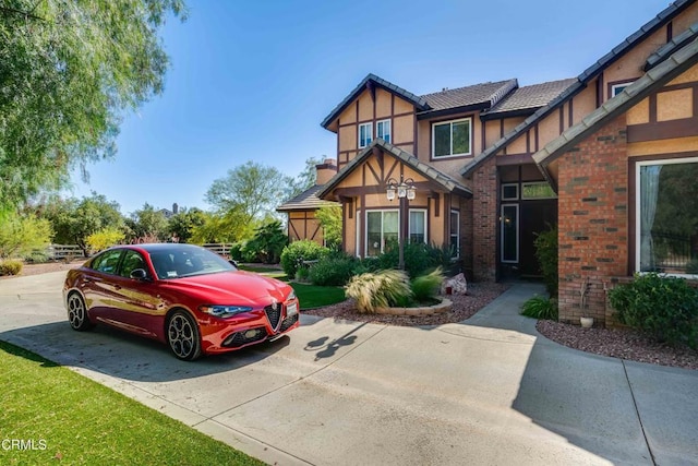 35135 Caprock Rd, Santa Clarita, CA 91390 - tudor house featuring stucco siding and brick siding