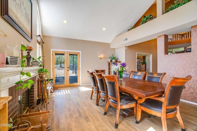 35135 Caprock Rd, Santa Clarita, CA 91390 - dining area with high vaulted ceiling, light wood-style flooring, french doors, and recessed lighting