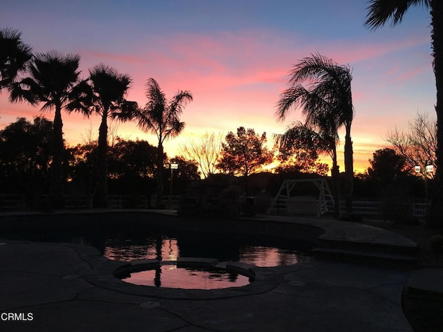 35135 Caprock Rd, Santa Clarita, CA 91390 - pool at dusk featuring a pool with connected hot tub
