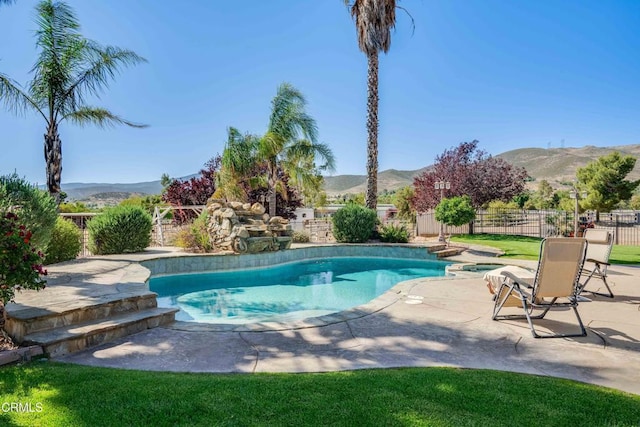 35135 Caprock Rd, Santa Clarita, CA 91390 - view of swimming pool with a mountain view, a fenced backyard, a patio, and a pool with connected hot tub