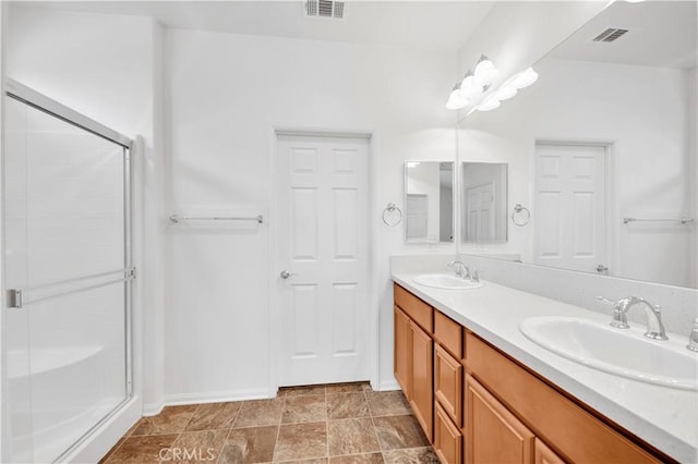 30268 Cherry Opal Ln, Menifee, CA 92584 - full bathroom with a shower stall, double vanity, and baseboards