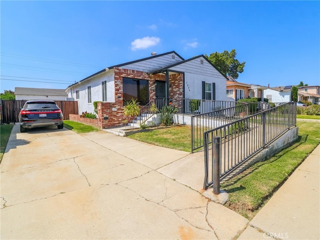 2026 W 94th Pl, Los Angeles, CA 90047 - view of front of property featuring driveway and brick siding