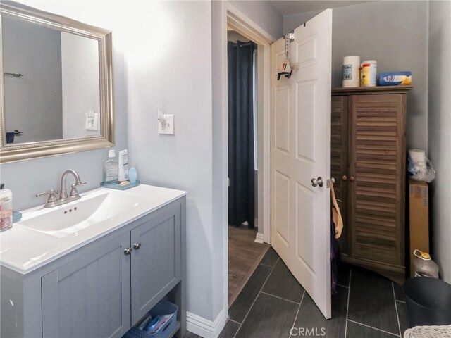 2026 W 94th Pl, Los Angeles, CA 90047 - bathroom with vanity and baseboards