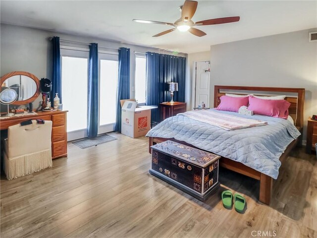 2026 W 94th Pl, Los Angeles, CA 90047 - bedroom with wood finished floors and ceiling fan