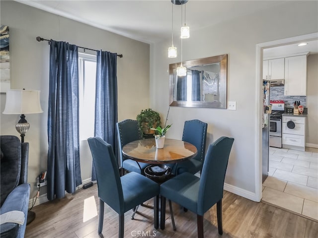 2026 W 94th Pl, Los Angeles, CA 90047 - dining room featuring light wood-style flooring and baseboards