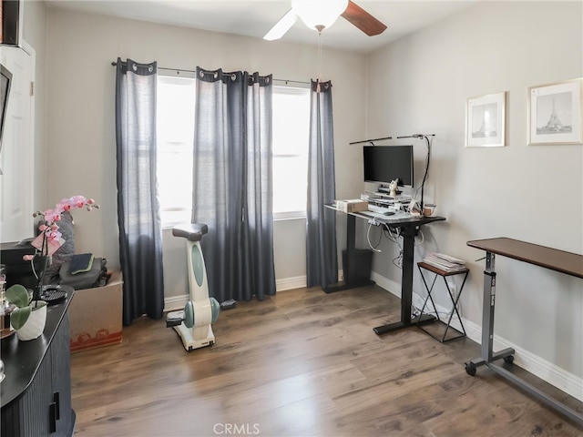 2026 W 94th Pl, Los Angeles, CA 90047 - home office with a ceiling fan, wood finished floors, and baseboards