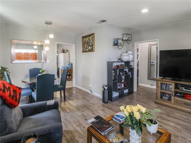 2026 W 94th Pl, Los Angeles, CA 90047 - living area with wood finished floors, baseboards, and recessed lighting