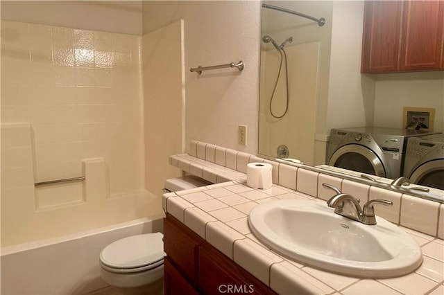 19126 Frances St, Apple Valley, CA 92308 - full bathroom featuring independent washer and dryer, toilet, shower / washtub combination, and vanity