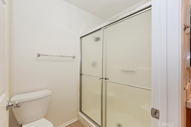 19126 Frances St, Apple Valley, CA 92308 - full bath featuring a stall shower, toilet, and baseboards