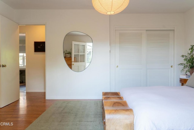 202 N Fulton St, Ojai, CA 93023 - bedroom featuring wood finished floors, a closet, and baseboards