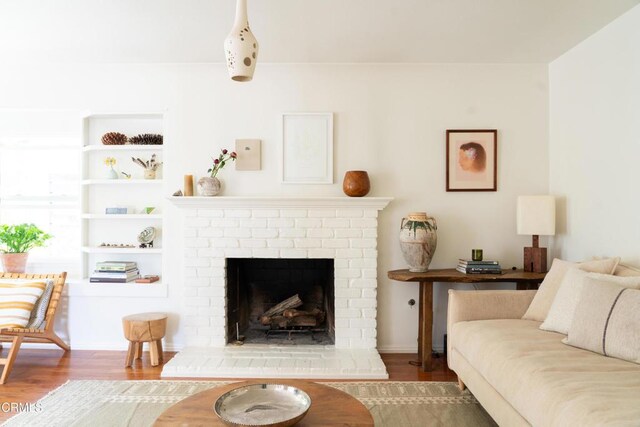 202 N Fulton St, Ojai, CA 93023 - living area with wood finished floors and a fireplace