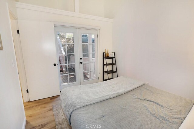 531 W Victoria Ct, Lake Arrowhead, CA 92352 - bedroom with french doors, wood finished floors, and access to outside