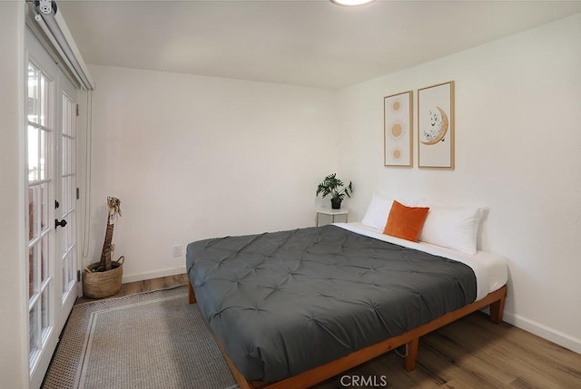531 W Victoria Ct, Lake Arrowhead, CA 92352 - bedroom featuring wood finished floors and baseboards